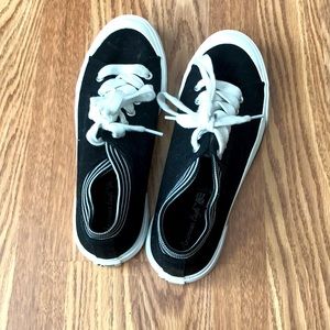 Black and white American eagle shoes.